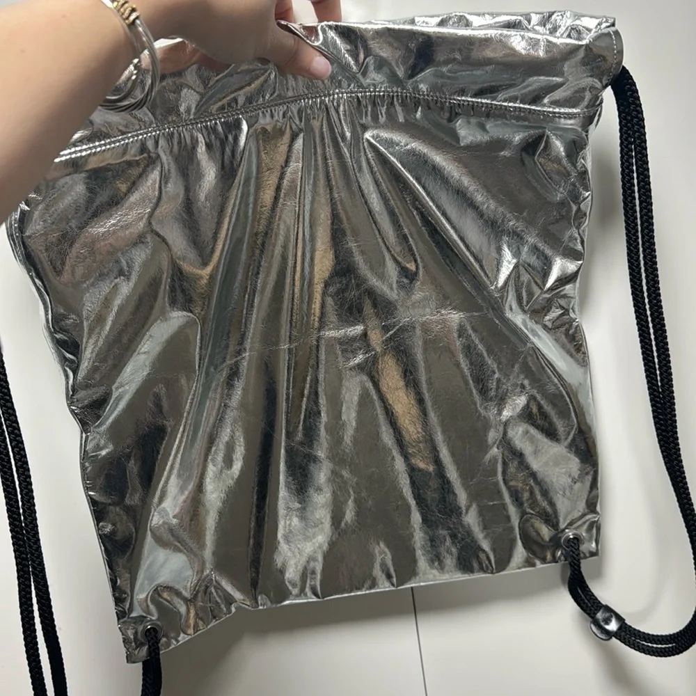 Saint Laurent Metallic Silver Drawstring Backpack